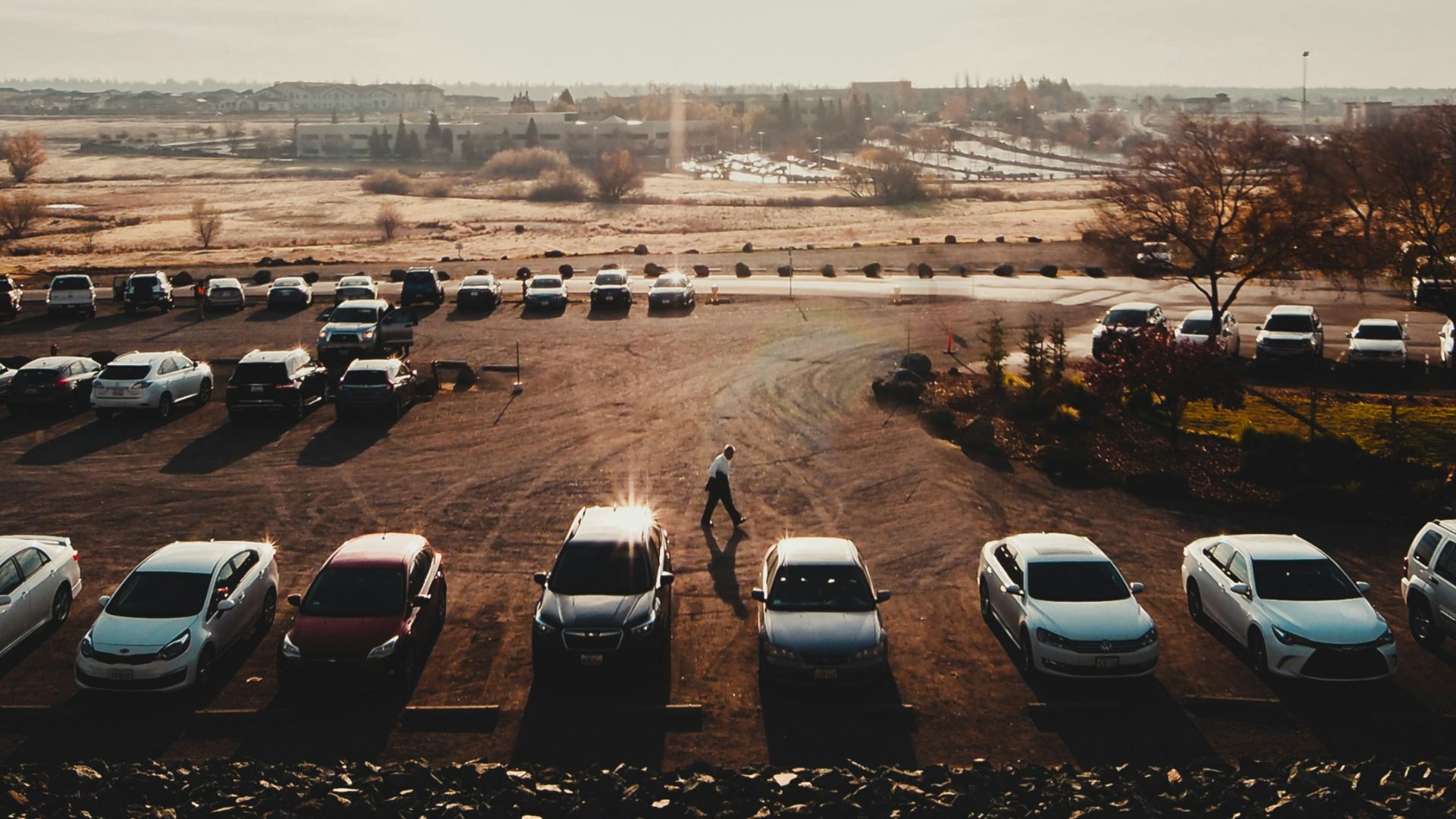 cars parked on parking lot during daytime