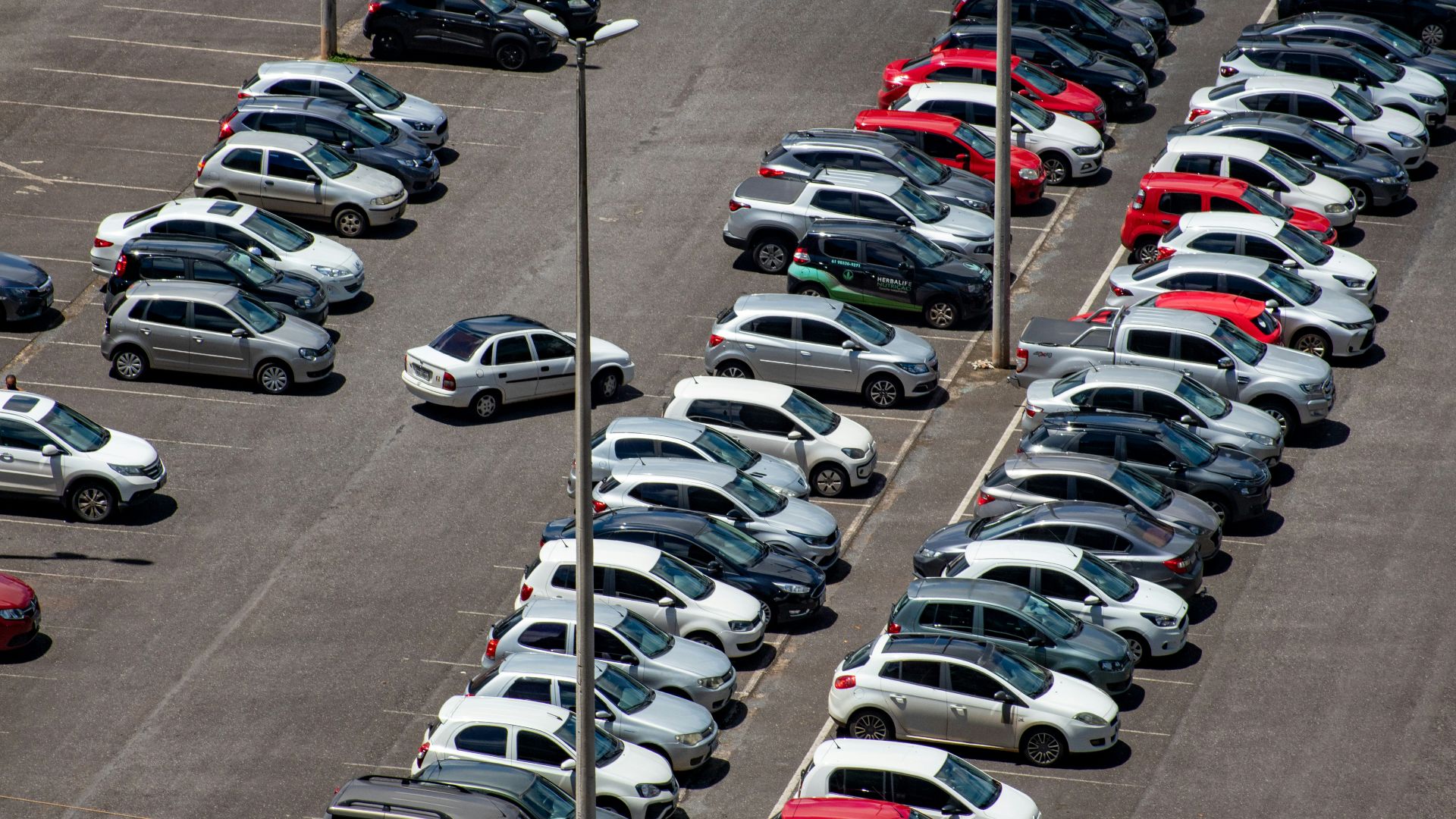 cars parked on parking lot during daytime