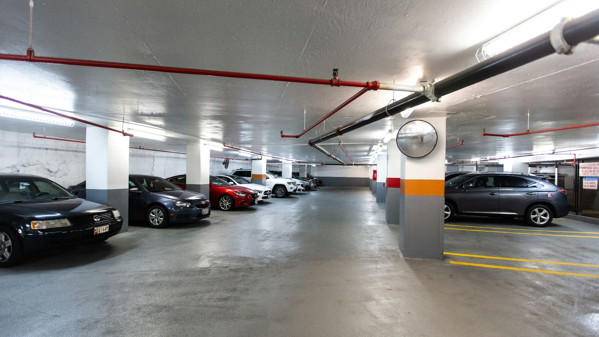 black and red car in a parking lot
