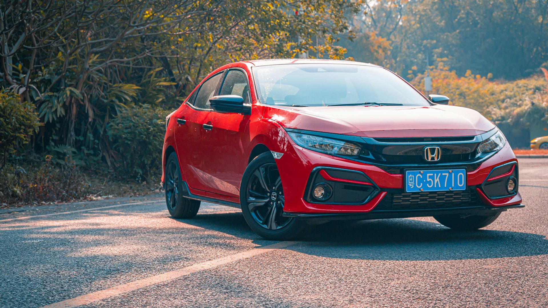 red audi r 8 on road during daytime