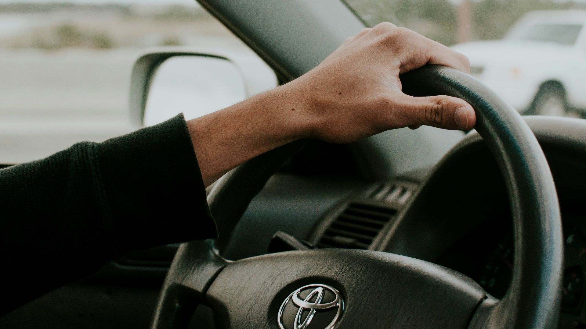 person driving Toyota car