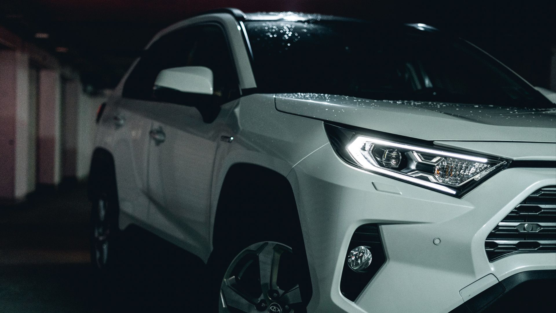 white and black car on black asphalt road
