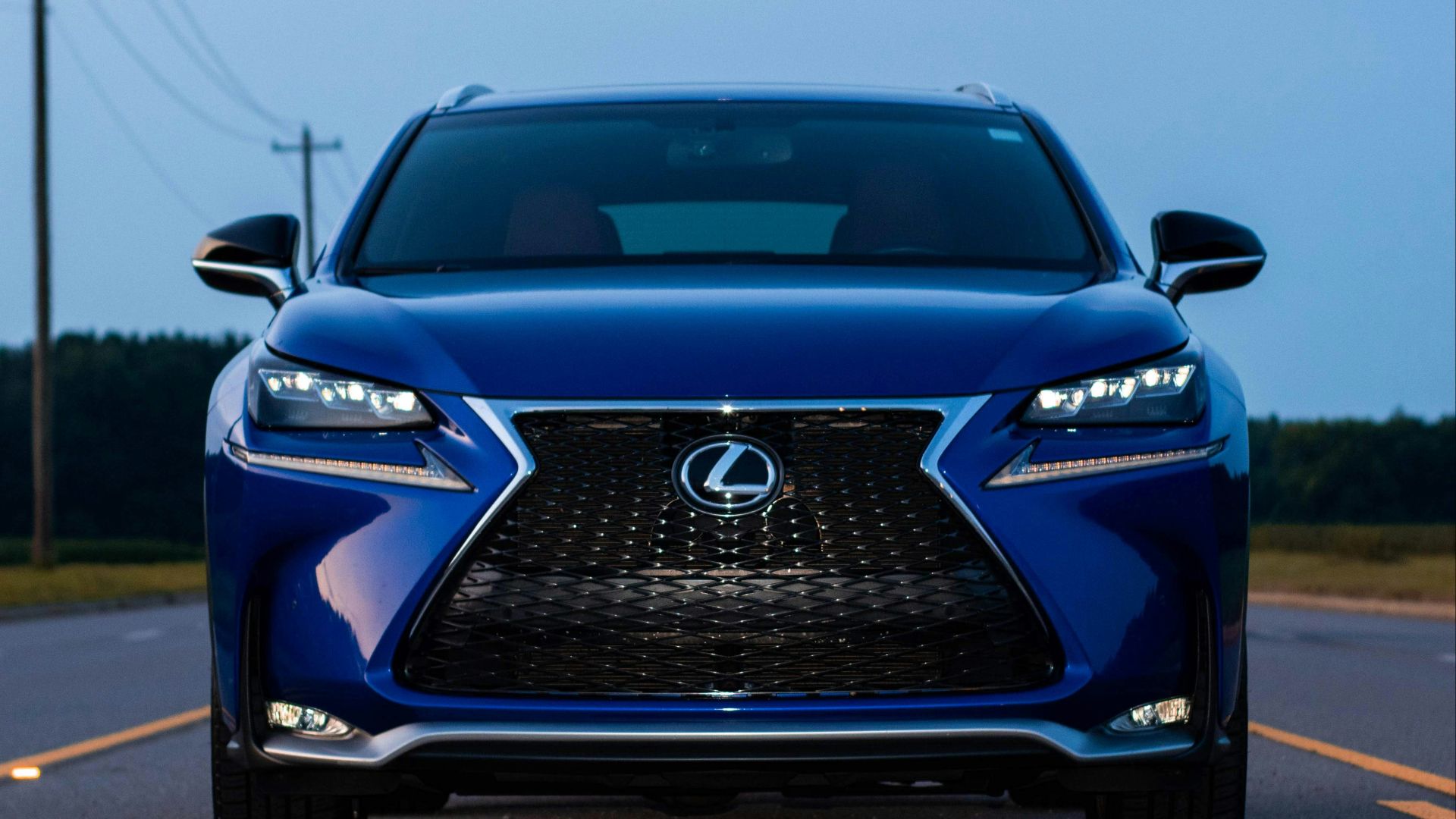 a blue car on a road