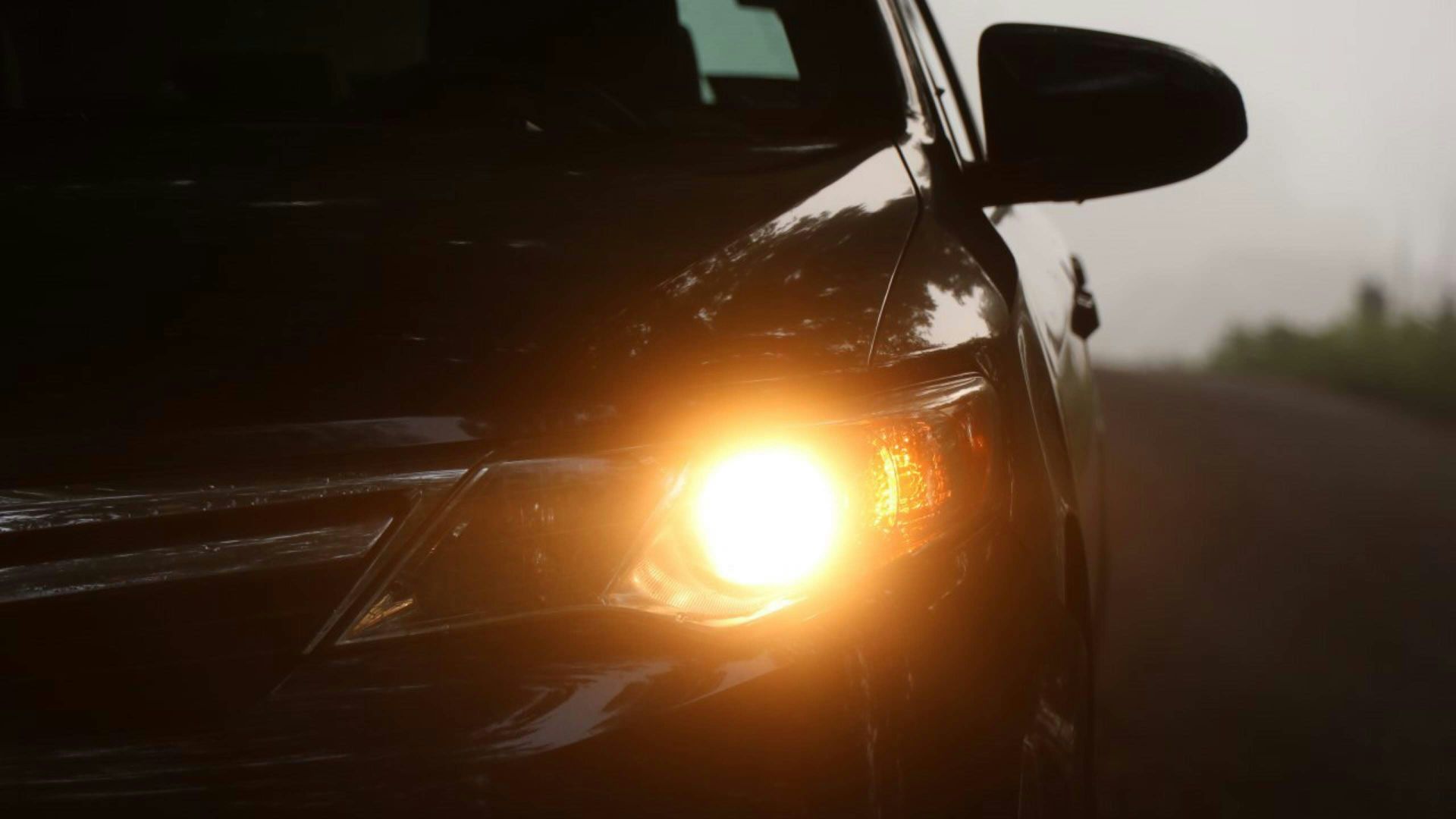 black car with yellow light