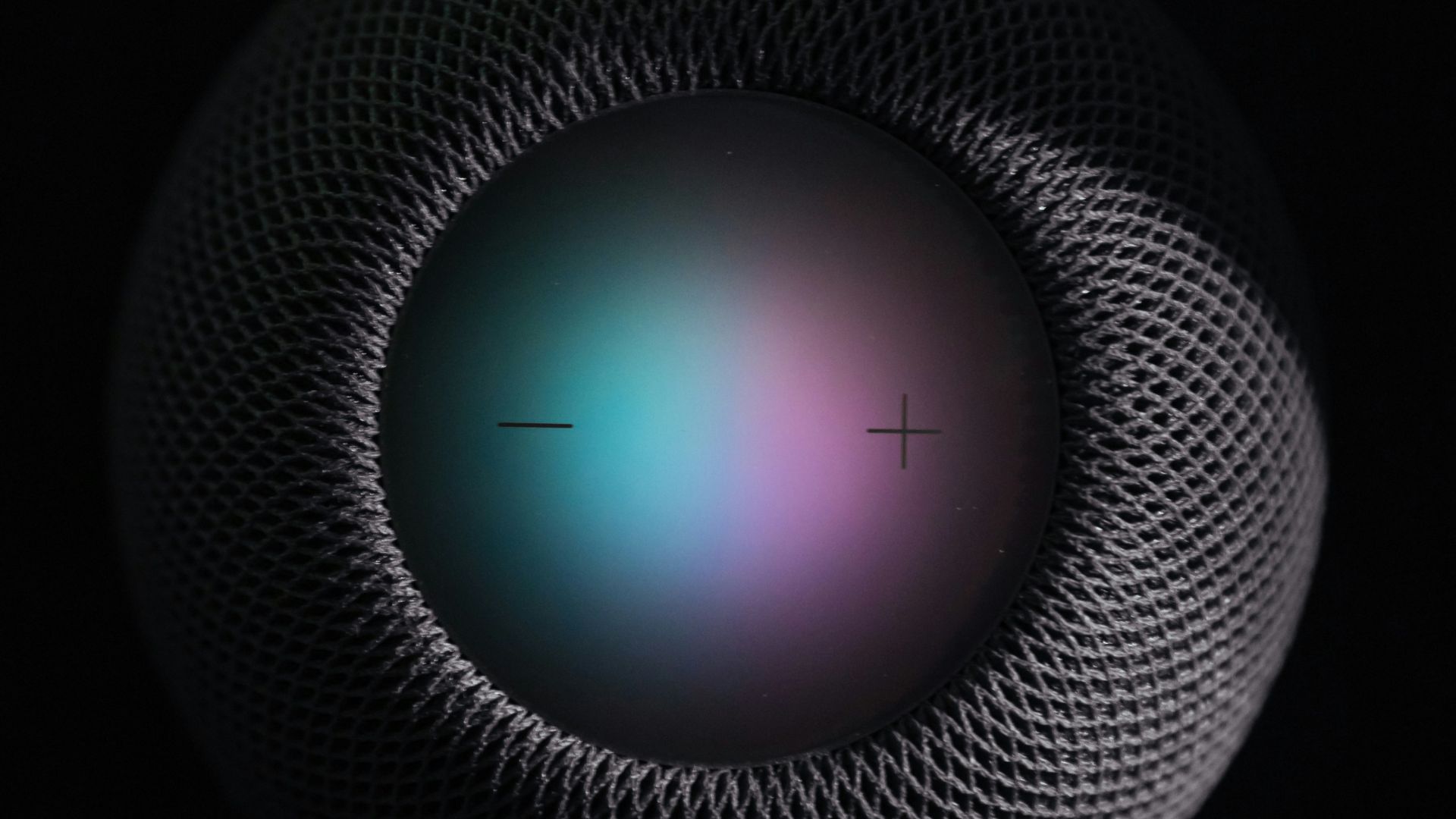 black and gray round portable speaker