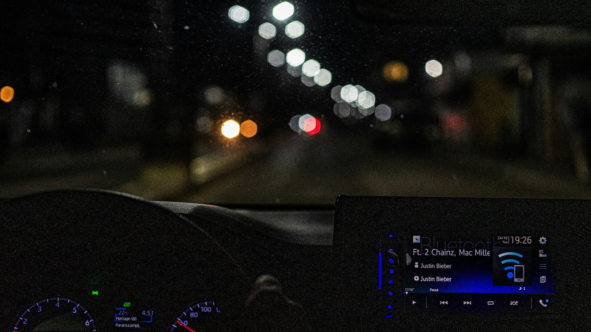 the dashboard of a car at night time