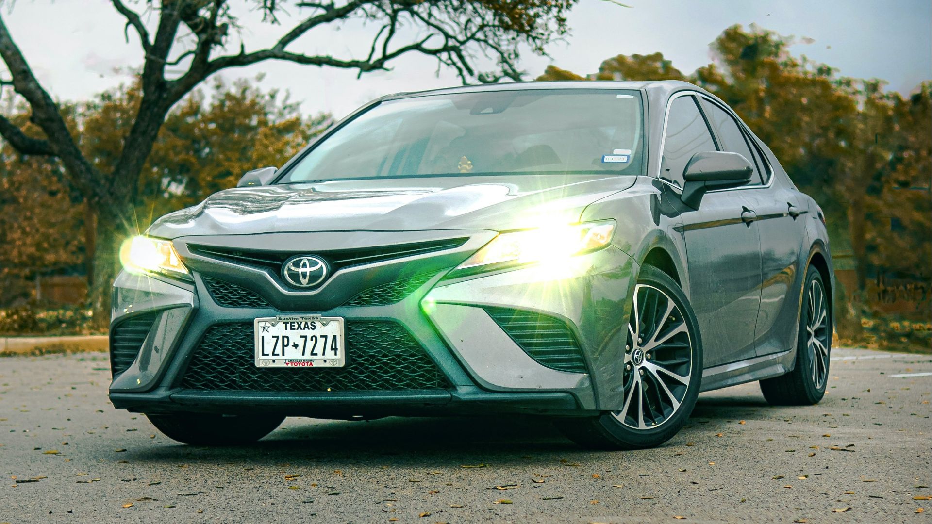green mercedes benz coupe on road during daytime