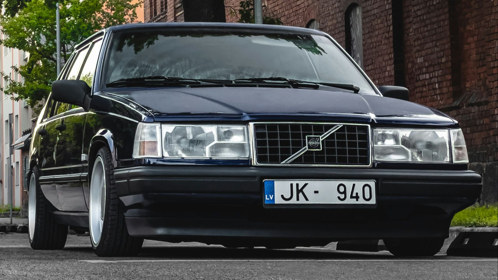 a black car parked on the side of the road