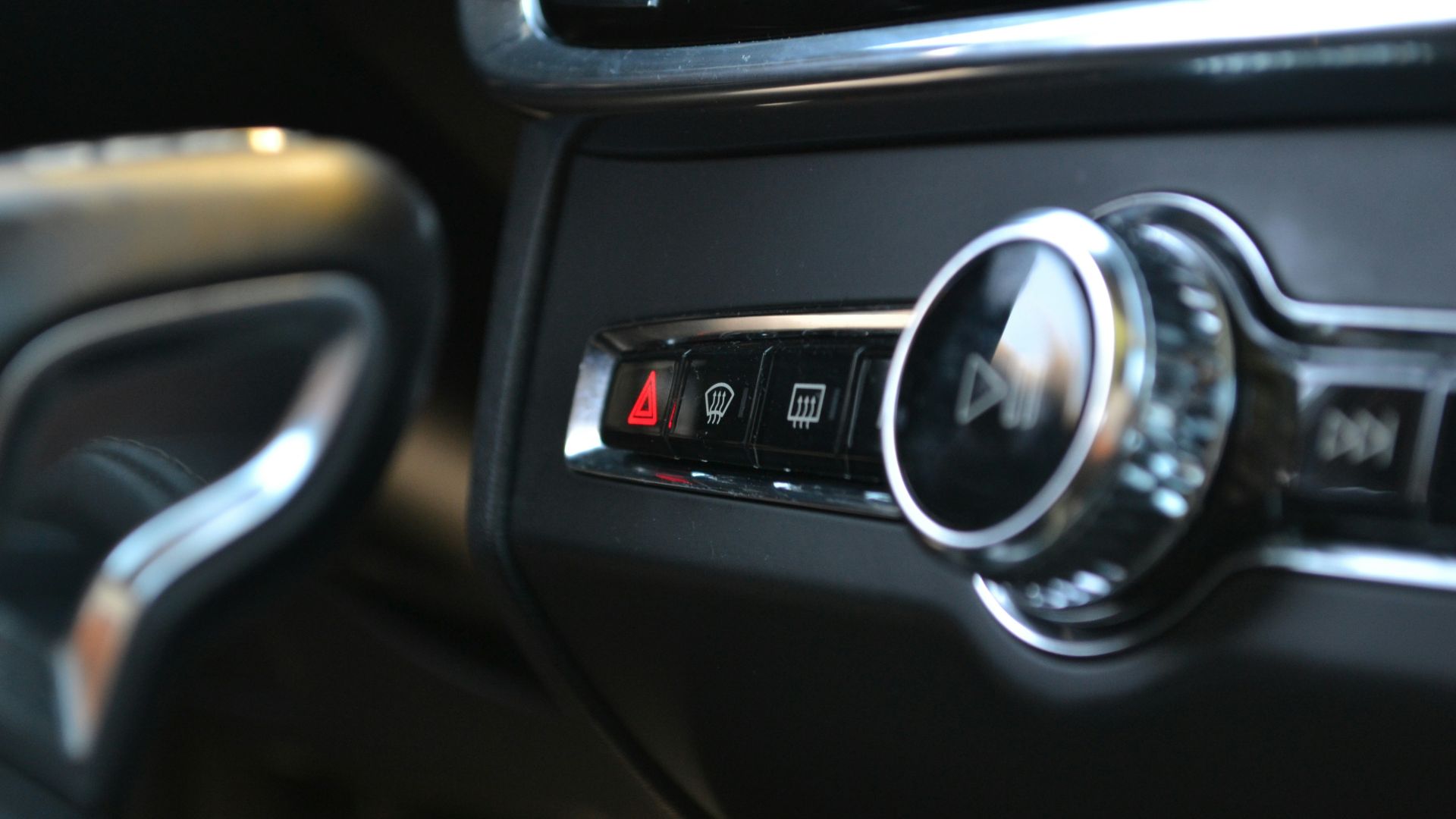 Car's interior controls, including hazard lights.