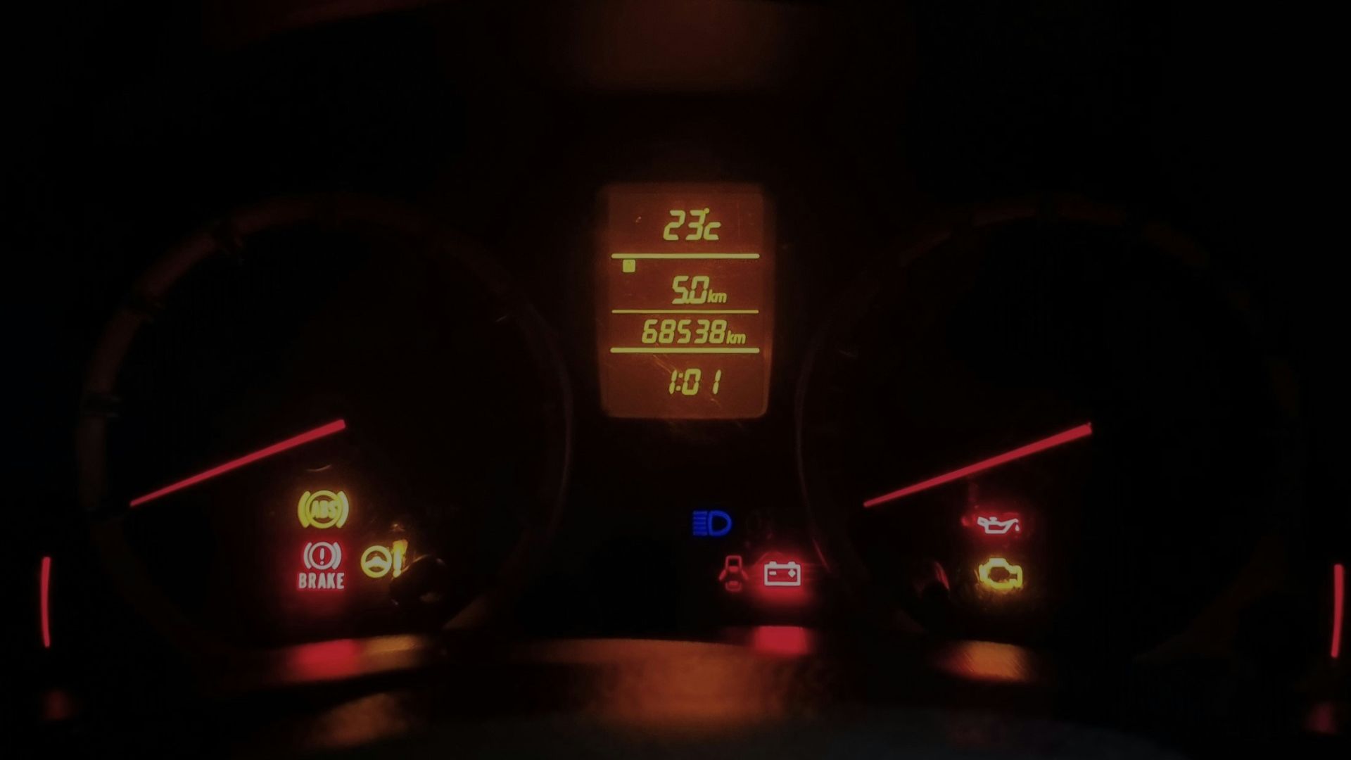 The dashboard of a car at night time