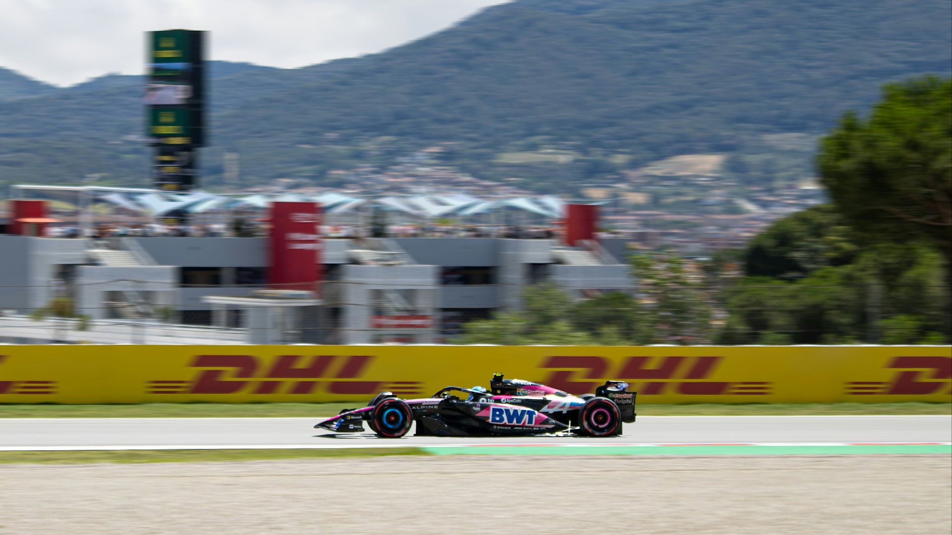 Formula 1 race car speeds down the track.