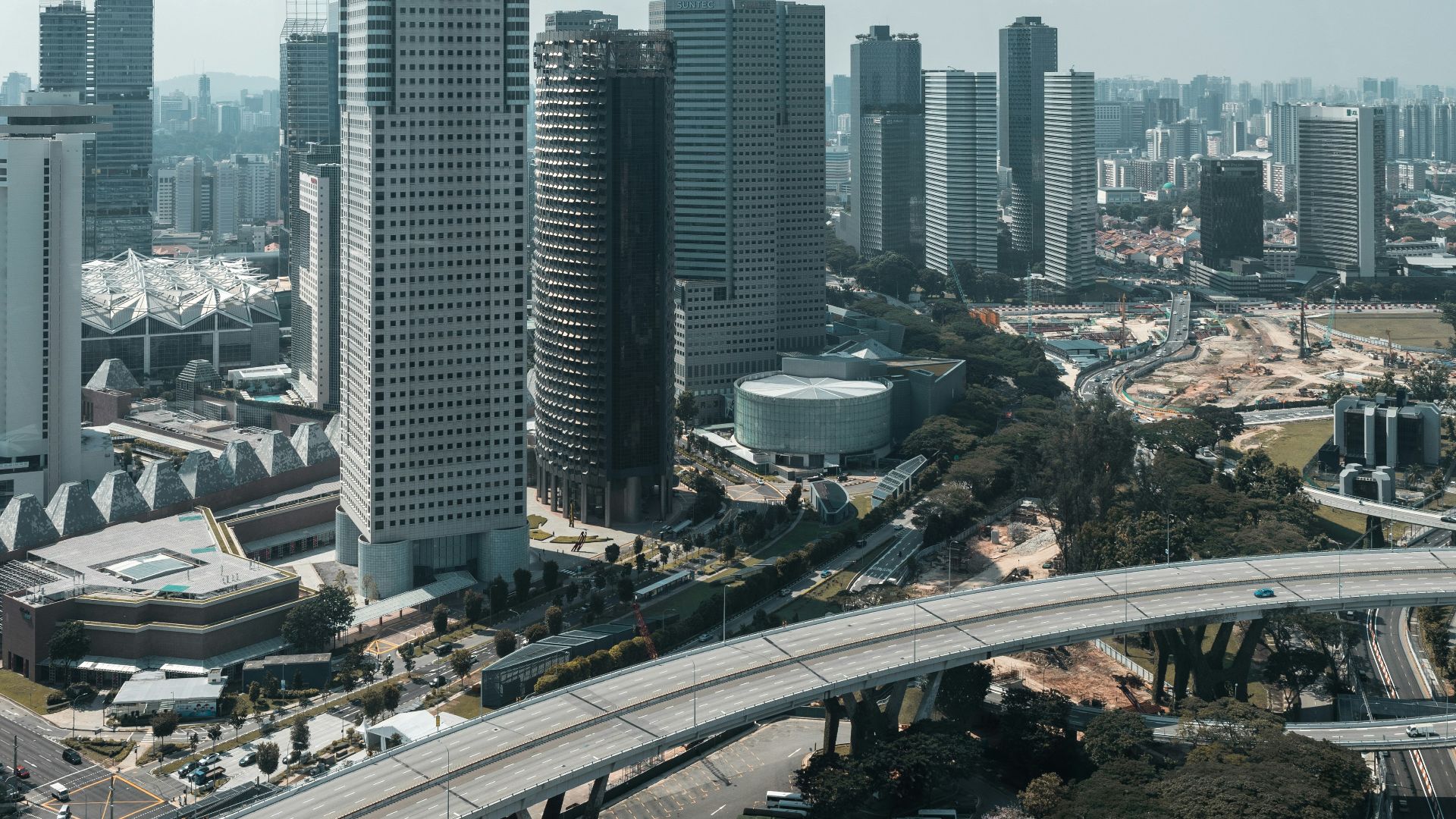 an aerial view of a city with tall buildings