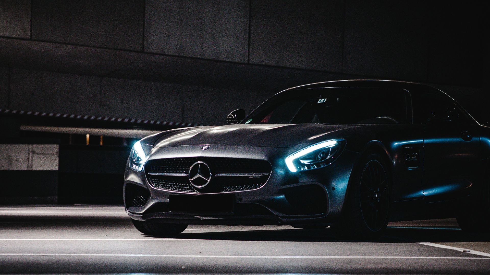 black porsche 911 parked on parking lot