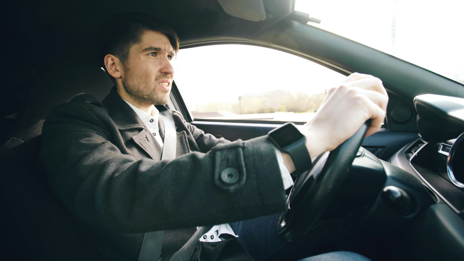Man driving a car with intensity