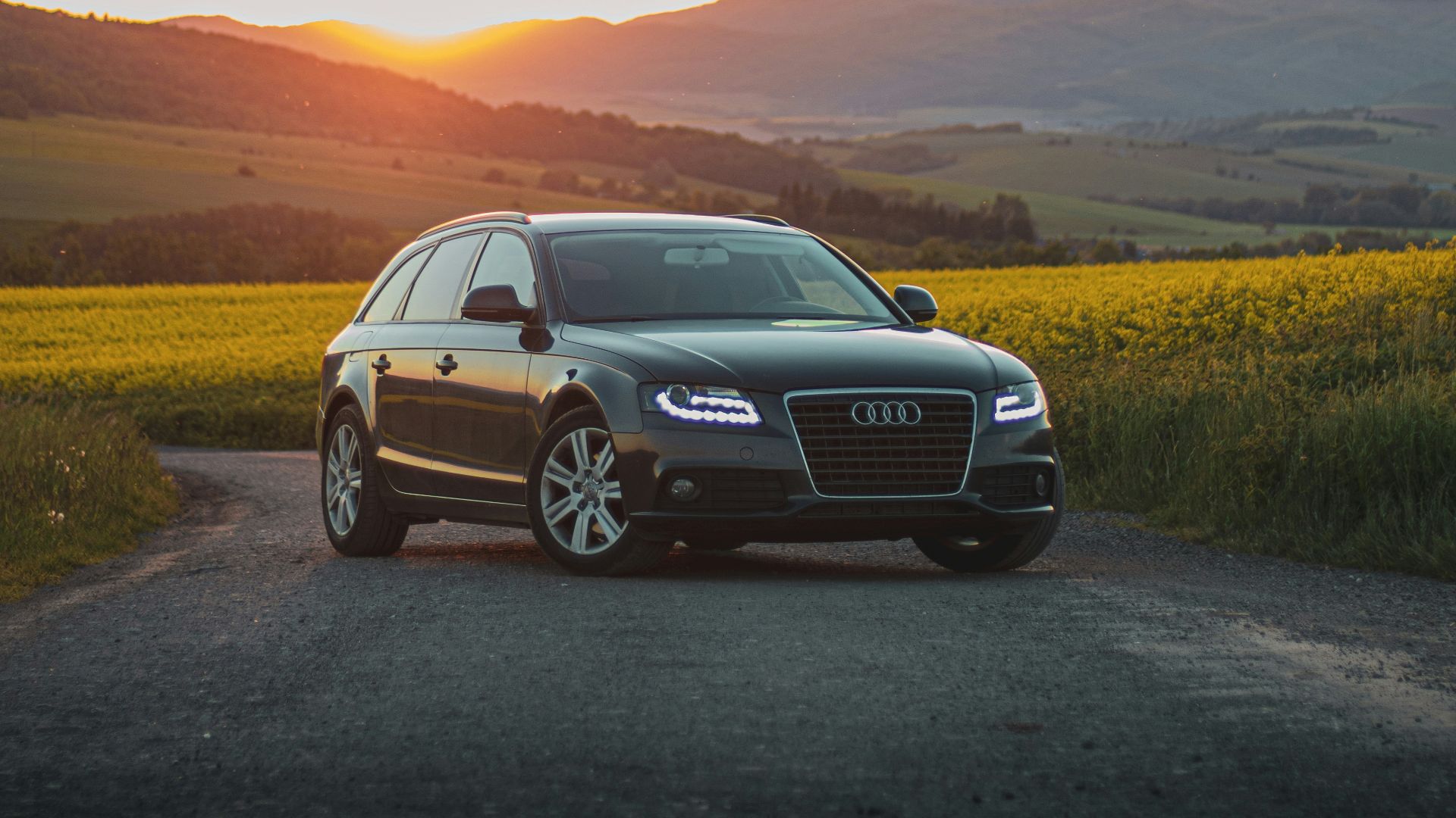 black audi a 4 on road during daytime