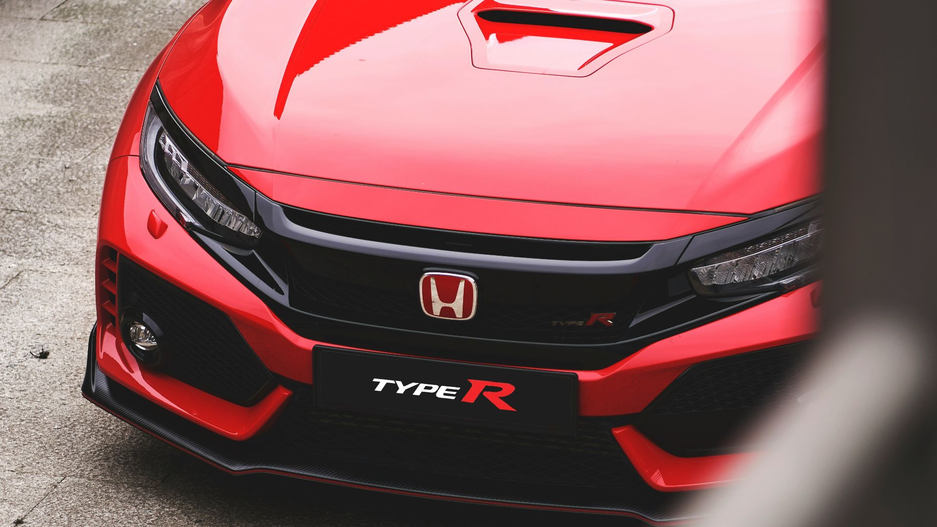 red Honda vehicle