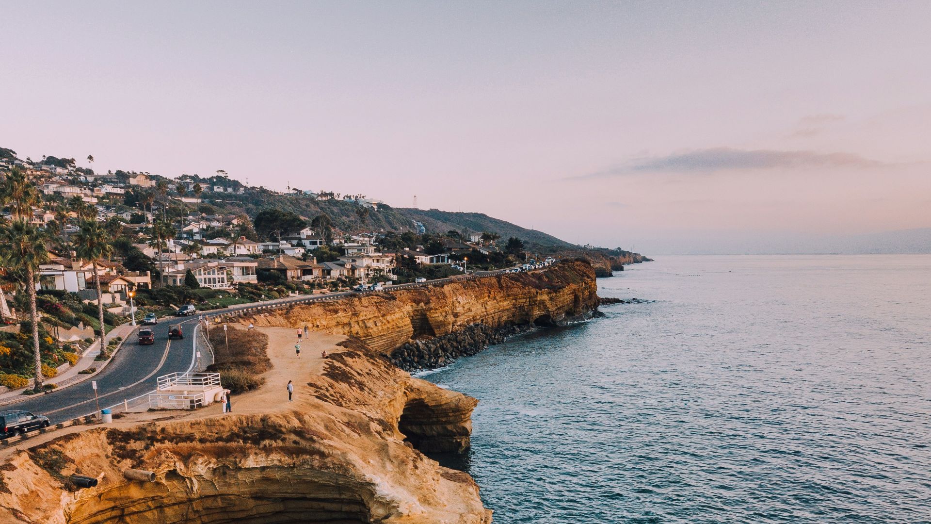 road on sea cliff during daytime