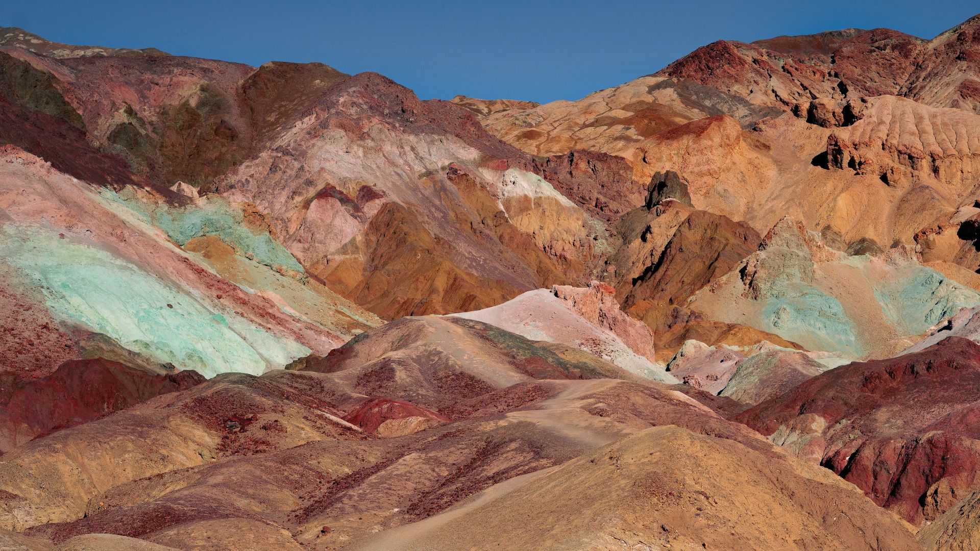 brown and gray mountains under blue sky during daytime