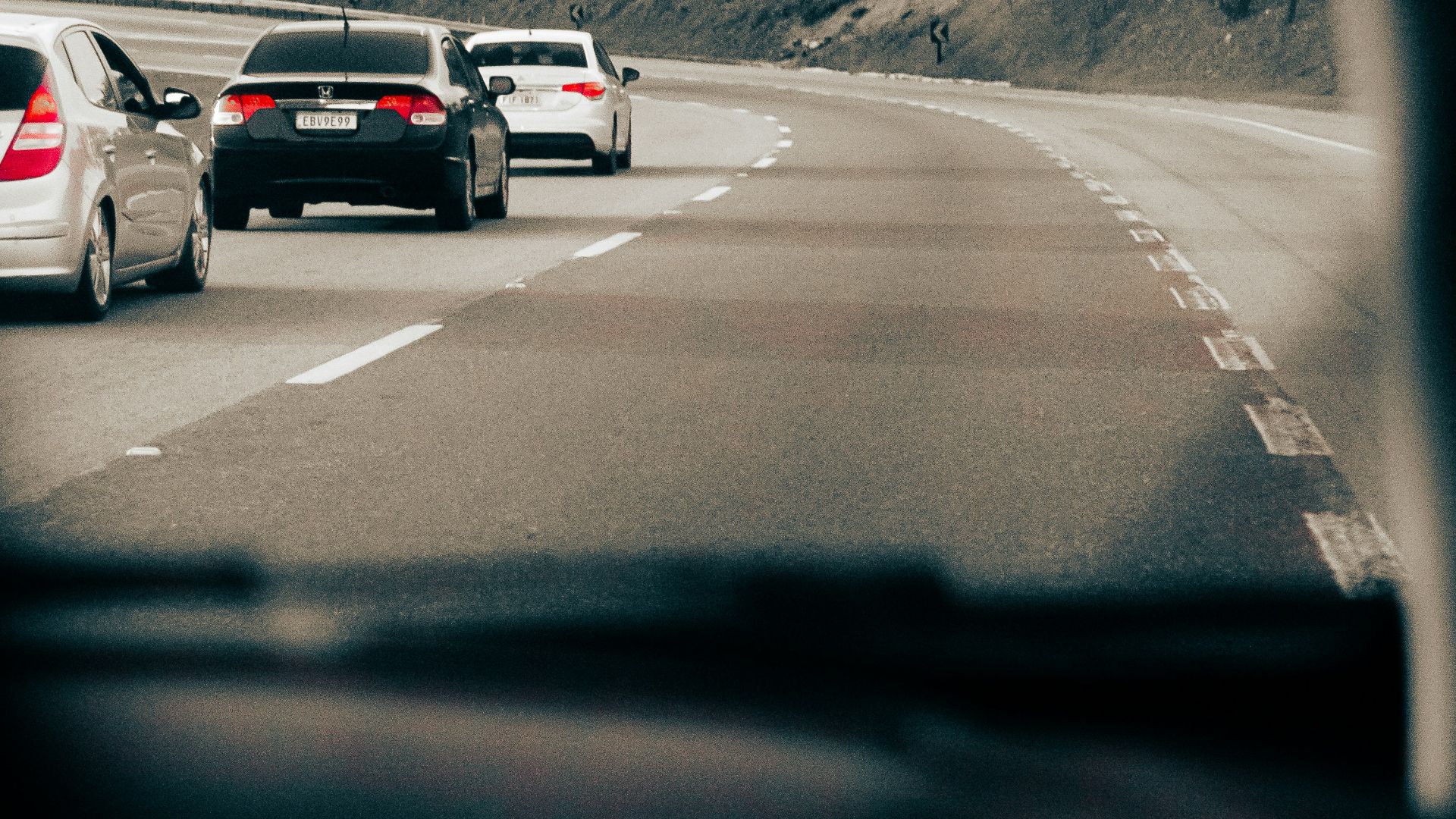 a group of cars on a road