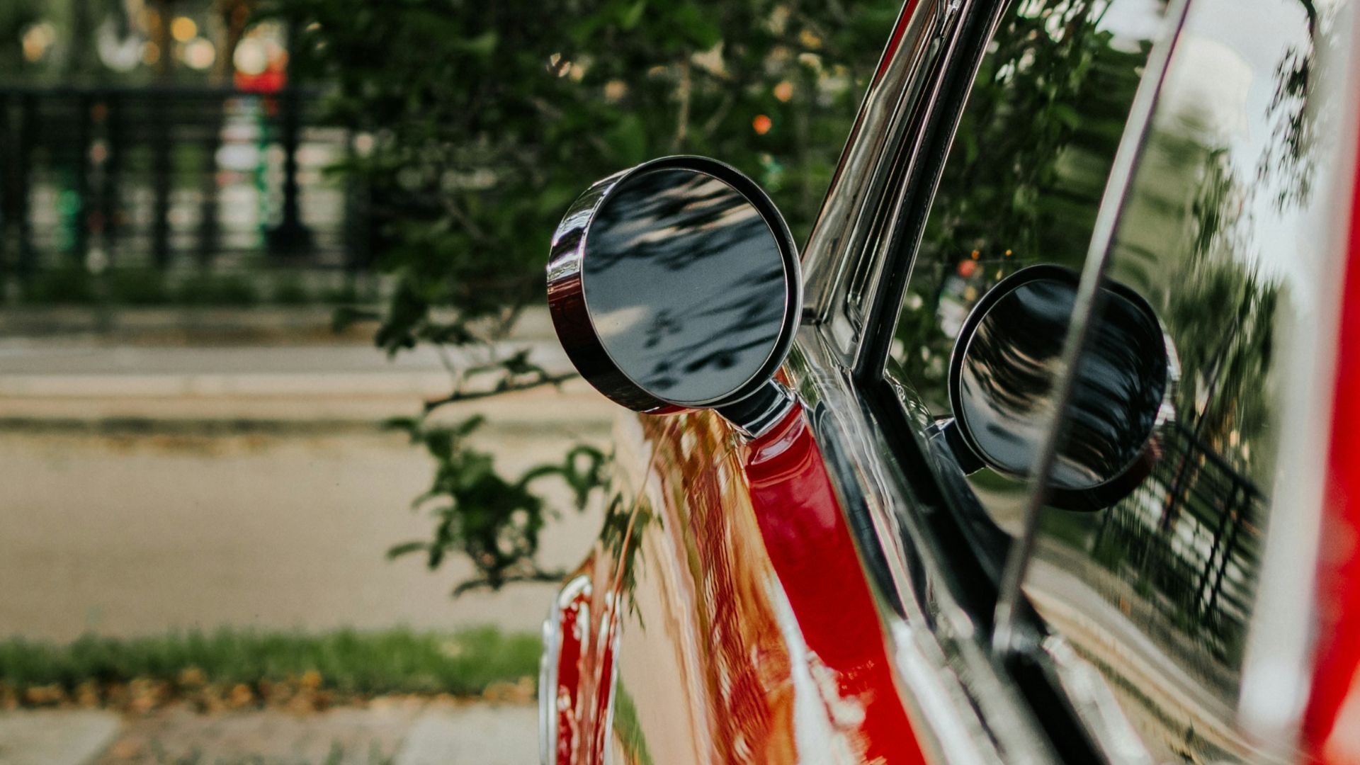 a red car parked on the side of the road