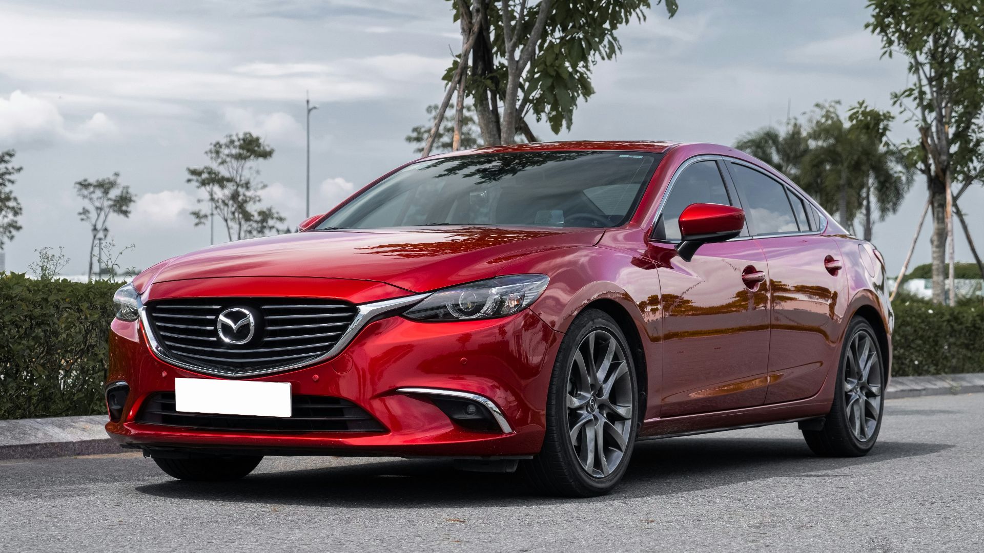 a red car parked on a street