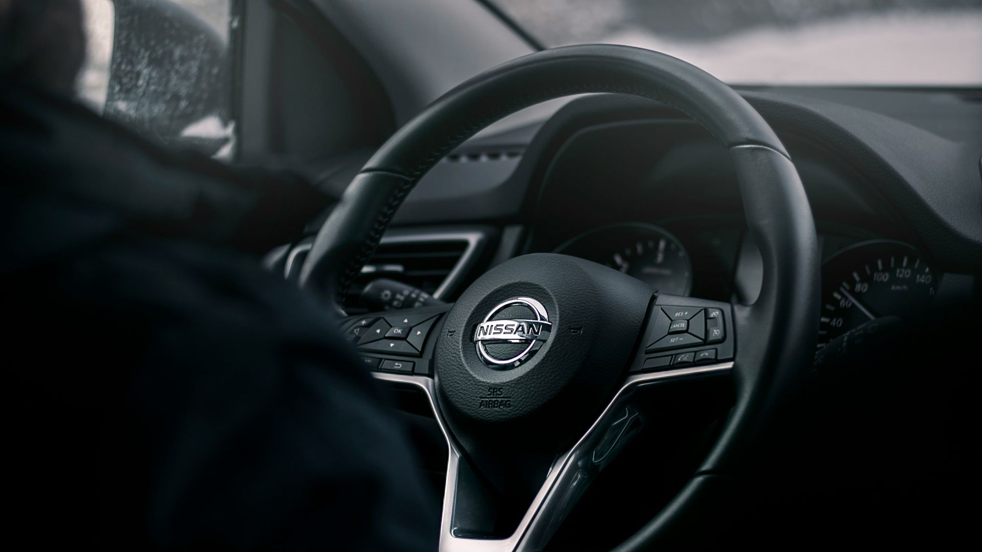 black Nissan steering wheel