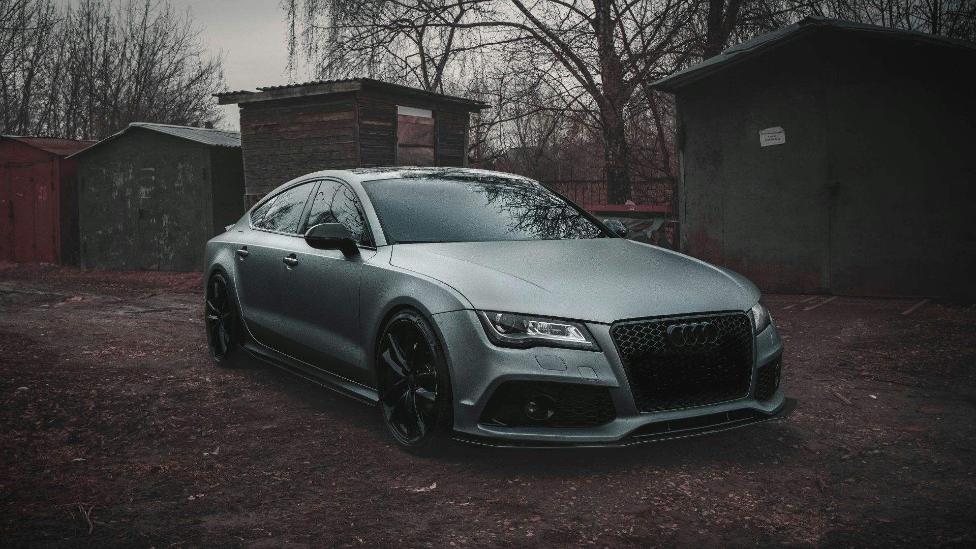 silver mercedes benz coupe parked near brown building